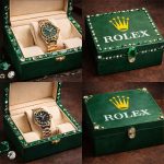Rolex logo stencil applied on luxury green watch boxes with gemstone accents (yellow crown + white text)